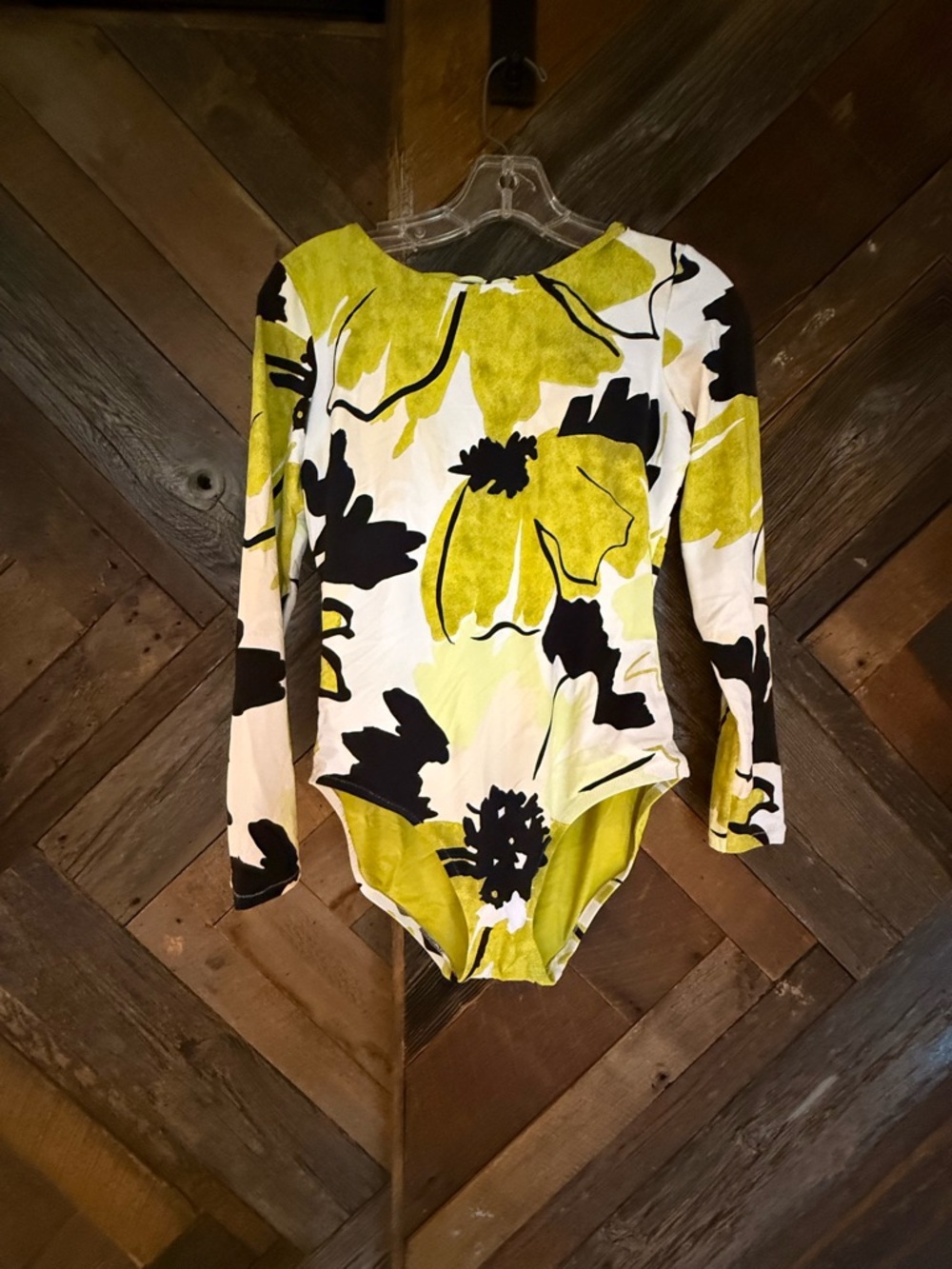 Calia long sleeve bathing suit with open back. Size 6. New.